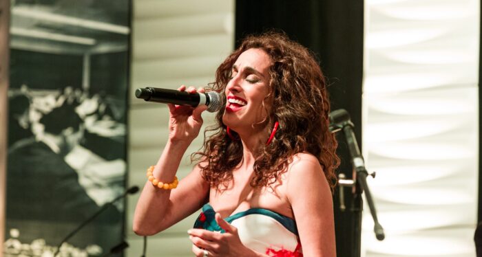 Amanda on stage with microphone